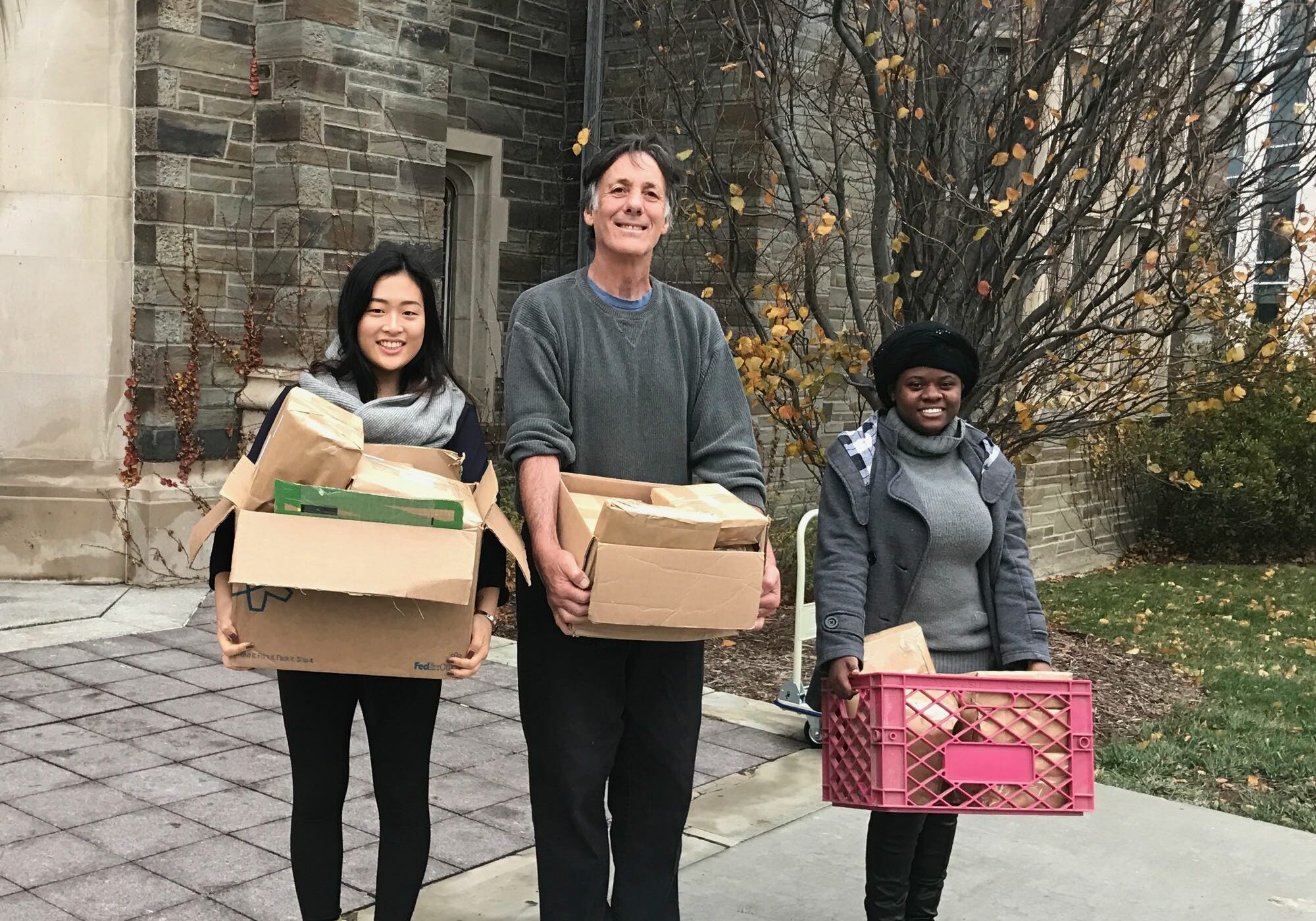 Clara, Gary, Yvette bringing packages to the post office
